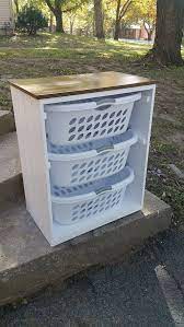 It's the perfect little shelf for our laundry baskets, and i feel like i'll be able to keep up on organization and sorting a lot better now. Laundry Basket Holder Laundry Room Decor By Designsbydomandmel Laundry Basket Holder Laundry Room Decor Wooden Laundry Basket