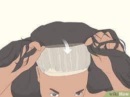 Braid your own hair, and style it to make it stay flat in your head. 3 Easy Ways To Put A Wig On If You Have Long Hair Wikihow