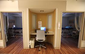 A Nurse Station Is Nestled In An Alcove Between Two Patient Rooms Healthcare Design Hospital Floor Plan Design