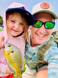 🎣 And so it begins! Mairin Jo caught her first fish today! She will catch  up to her brother in no time. KMBC 9