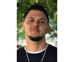 John Mikels Obituary (1986