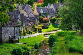 Visiting Bibury The Most Charming Ancient Village In England Living Nomads Travel Tips Guides News Information England Countryside Cotswolds England England Tourism
