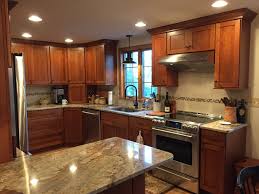 Dynasty Plainfield Cherry Nutmeg Kitchen Cabinetry With Typhoon Bordeaux Granite Countertops Kitchen Cabinets Kitchen Kitchen Cabinets For Sale