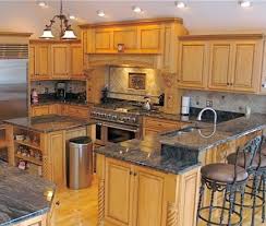 It is very common because it uses so little material that makes it cheap, and it covers the edge between the countertop and wall to disguise a wall that is not straight and/or granite that was not cut perfectly. Backsplash Granite Kitchen Studio