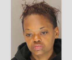 Woman wanted for armed robbery left debit card at crime scene: police