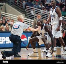 NBA official Jess Kersey (20) tries to keep Orlando Magic forward Charles  Outlaw down after tackling him to the floor to end a scuffle between Outlaw  and Sacramento Kings' Vernon Maxwell Monday,