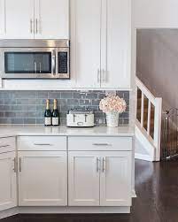 By bringing the backsplash from the countertops to the ceiling, the designer created a sizable accent wall that appears as if it was carved right out of the earth. Shop My Instagram The Greenspring Home Gray Kitchen Backsplash Backsplash Kitchen White Cabinets Kitchen Cabinets Decor