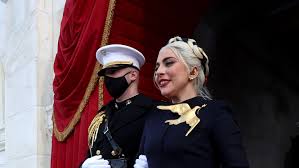 Lady gaga arrives to sing the national anthem with marine capt. Who Wore What At The Inauguration Lots Of Purple Pearls And American Designers