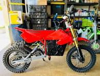 Switching rear suspension to top swingarm hole?