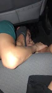 Discover the provocative world of foot worship in car as smelly feet are given ultimate devotion inside a car