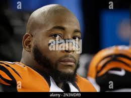 Five-year-old Cleveland Browns fan Rowan Urbach, left, uses binoculars as  his grandfather, Joe Drago, takes pictures with his cell phone during  pre-game activity before the Browns play host to the St. Louis