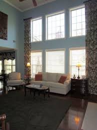 The Curtains Great Room Two Story Great Room In Aqua With Ivory Couch Two Story Great Window Treatments Living Room Curtains Living Room Living Room Sofa