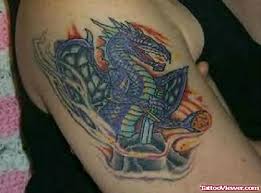 It is a type of a dragon tattoo which is blue in color. Fire Dragon Tattoo On Shoulder