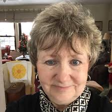 Where to find beach cross stitch designs, including a lighthouse pattern?