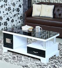 This coffee table presented is constructed from cherry veneer, making it quite sturdy. Buy Millie Tempered Glass Coffee Table In Glossy White Black By Athena Crafts Online Modern Rectangular Coffee Tables Tables Furniture Pepperfry Product