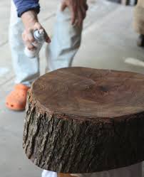 Stripping the bark off the tree stump for the coffee table in the family room at the 2014 blog cabin in winter haven, fl. How To Diy Stump Table 17 Apart