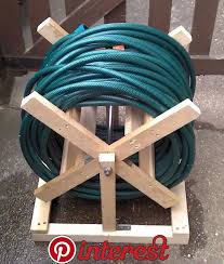 10 Most Inspirational Hose Caddy Design Ideas For Your Garden A Hose Reel Provides You A Tidy Place To Put Awa Garden Hose Reel Garden Hose Storage Hose Reel