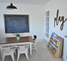 Playroom With Large Chalkboard And Kids Farmhouse Table Kid Room Decor Farmhouse Playroom Modern Playroom