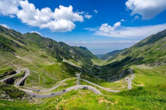 Transalpina (DN67C) Romania — 2,145m Romania's highest road, stretching  across the Parâng Mountains with long ridge-top sections and wide,  uninterrupted views over remote alpine terrain. The route runs above the  valleys for
