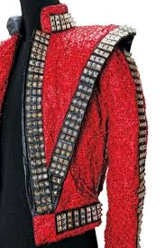 Black military jacket with gold buttons and arm badges. The King Of Style Dressing Michael Jackson Michael Jackson Costume Michael Jackson Outfits Michael Jackson Pics