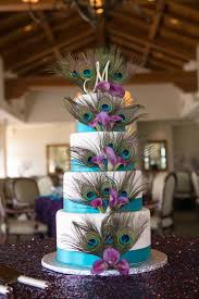 Peacock Wedding Cake With Sparkley Tablecloth The Most Perfect Cake Ever Only Thing I M With Images Peacock Wedding Centerpieces Peacock Wedding Cake Peacock Wedding Theme