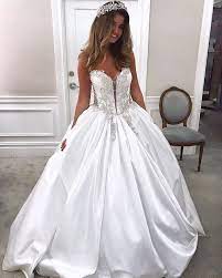 Her line varies from classic princess like ball gowns to bold show stopping fashion forward couture creations. Strapless Silk Ball Gown Wedding Dress By Pnina Tornai Photo Jacmichels Regr Pnina Tornai Wedding Dress Pnina Tornai Ball Gown Wedding Dresses Kleinfeld
