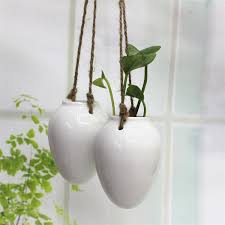 All categories resin pots miniatures garden decor ceramic pots stakes glass bowls metal pots gifts birthday home garden house mushroom decoration for garden decor or home decoration. Flower Pots Planters Home Decor Ceramic Pots Egg Shape Hanging Flower Vase Ceramic Bottle Wall Hanging Decor White Pots Vase And Flowers Vase Black And White From Fanggunianglian 42 73 Dhgate Com