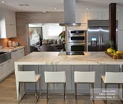 This two tone kitchen features warm undertones of purestyle glacier gray cabinets and a purestyle white kitchen island for a pleasing color palette. White Cabinets With A Gray Kitchen Island Homecrest
