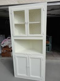 Oak Corner Cabinet Painted White I Removed The Glass And Stapled Chicken Wire And Added A Appl Oak Corner Cabinet White Corner Cabinet Kitchen Corner Cupboard