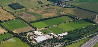 Hi, my football team i support manchester city fc have just released plans for a new training ground across the road was just wondering what other training grounds are like and how close there stadium's are. Arsenal And Watford Training Ground