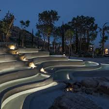 A Shopping Trip Turns Into An Evocative Experience With The Shops Of This Large Outdoors L Landscape Lighting Design Water Architecture Water Feature Lighting