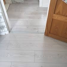 White laminate flooring involves laminating a multilayered synthetic flooring that replicates the look of a wooden surface by using an applique layer under a protective layer. Laminate Deluxe White Brushed Oak 12mm X 195mm
