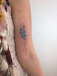 Each of the flowers has five blue petals that grow at the end of the stem. Forget Me Not Flower Tattoo Entertainmentmesh