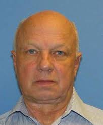 Police search home of slain ex-Pentagon official