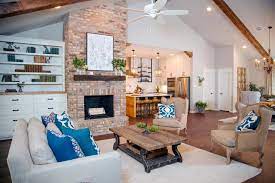A cathedral ceiling is a classic architectural feature in a home. Living Room With Vaulted Ceiling And Brick Fireplace Hgtv