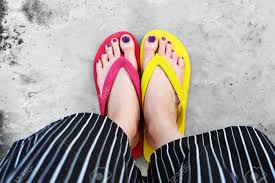 Top view, photo of female legs in beach flip flops on a wooden old floor. Red And Yellow Flip Flops Selfie Woman Wearing Flip Flop Standing Stock Photo Picture And Royalty Free Image Image 89440802