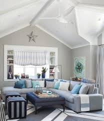 Beige Sand Walls Grey Couch With Blue Cushions Diycoastaldecor Cottage Style Living Room Coastal Decorating Living Room Coastal Living Rooms