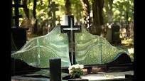 Large family monument in the cemetery – black granite cross and glass waves  by Glasstone.eu