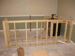 Framing basement walls was the first bit step to finishing my basement. My Basement Bar Build Basement Bar Designs Building A Basement Basement Bar