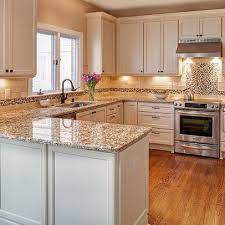 I'm looking into remodeling my kitchen. Giallo Napoli Kitchen Design Ideas Pictures Remodel And Decor Kitchen Remodel Small Peninsula Kitchen Design Kitchen Design Small