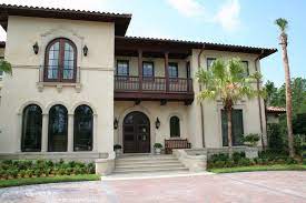 Mediterranean style with a few touches of spanish architecture as well. Arched Window Trim Mediterranean Exterior With Cast Stone Door Trim Jpg 990 660 Pixels Mediterranean Exterior Arched Windows Window Trim