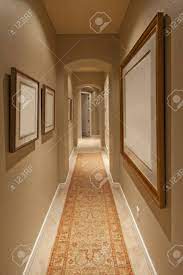 Opt for a warm paint colour, some elegant wall panelling, or a patterned wallpaper to lend the space character. Empty Hallway In House Stock Photo Picture And Royalty Free Image Image 21010342