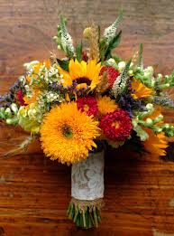Beautiful hand tied bridal bouquets for the bride and her bridal party. Early Autumn Bridal Bouquet Sunflowers Aster Wheat Wax Flower Veronica Snap Dragon Bridal Bouquet Fall Fall Wedding Bouquets Sunflower Bridesmaid Flowers