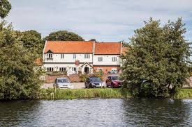 The bathroom is partially open and features a shower. Wayford Bridge Inn Hotel Rentals Stalham