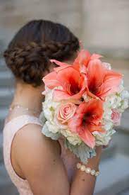 A gorgeous wedding cake in coral and white, with gold and blush sugar blooms on top. Color Inspiration Perfect Coral And Gold Wedding Ideas Modwedding Wedding Flowers Summer Summer Wedding Bouquets Coral Gold Weddings