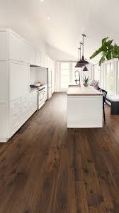 To Get The Most Out Of Those Bright White Cabinets We Ve Paired A Medium Brown Hardwood Floor Abella Acac Hardwood Floors Dark Hardwood Floor Colors Flooring
