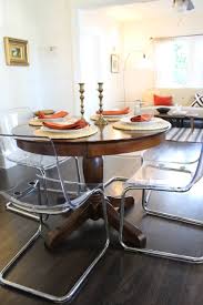 In modern times it is usually adjacent to the kitchen for convenience in serving, although in medieval times it was often on an. Clear Acrylic Dining Chairs Paired With Traditional Pedestal Table Eclectic Dining Room Los Angeles By Madison Modern Home Houzz