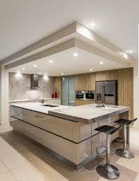 In this kitchen designed by hecker guthrie, the layout is perfect for cooking, there's plenty of story space since the cabinets reach up the ceiling, and the understated bar stools do a nice job. Pin By Ivana On Home Kitchen Ceiling Design Dream Kitchens Design Modern Kitchen Design