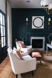 Want a fresh perspective for your fireplace area? Black Paneled Accent Wall With Black Fireplace Mantel Transitional Den Library Office