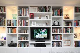 Bespoke Shelving Unit With Symmetrical But Thick Random Shelves Contemporary Shelving Home Library Design Living Room Wall Units